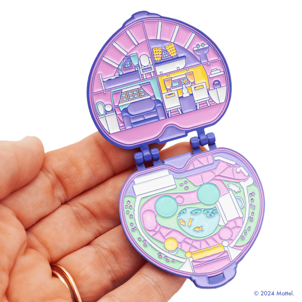 Purple Heart Compact Hinge Pin. This tiny Polly magnet can stick anywhere – inside the compact in her playhouse or outside on the landscape, and even on your refrigerator! 