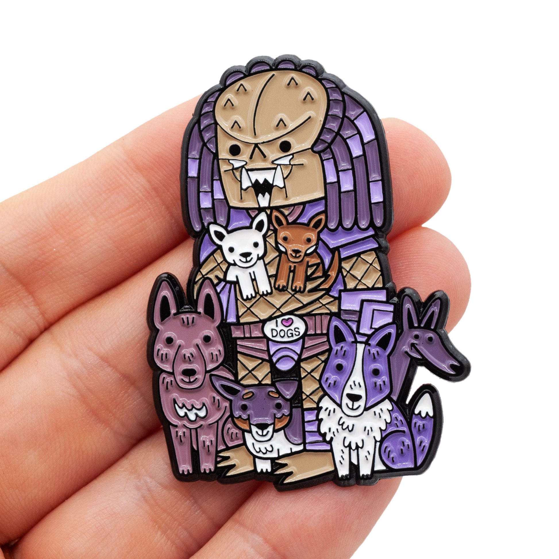 Hand holding Predator Team Dogs Enamel Pin