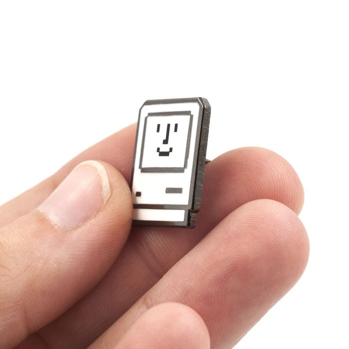 Personal computer icon with a smiling face inside.