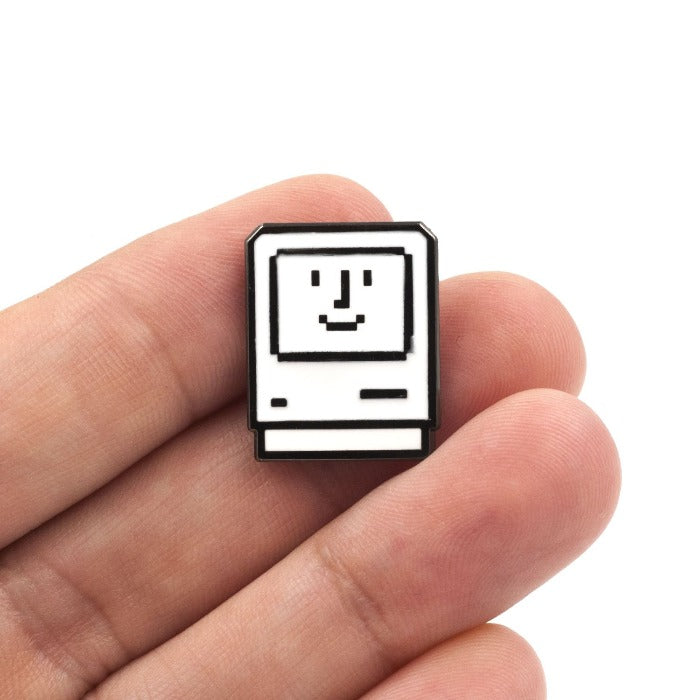 Personal computer icon with a smiling face inside.